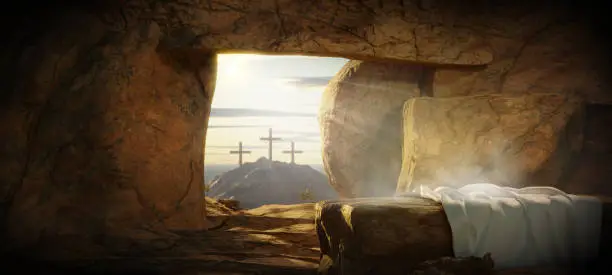 Crucifixion and Resurrection. He is Risen. Empty tomb of Jesus with crosses in the background and cinematic lighting. Easter or Resurrection