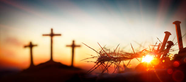 Crown Of Thorns And Bloody Nails At Sunset With Defocused Crosses On Hill And Flare Lights Effects